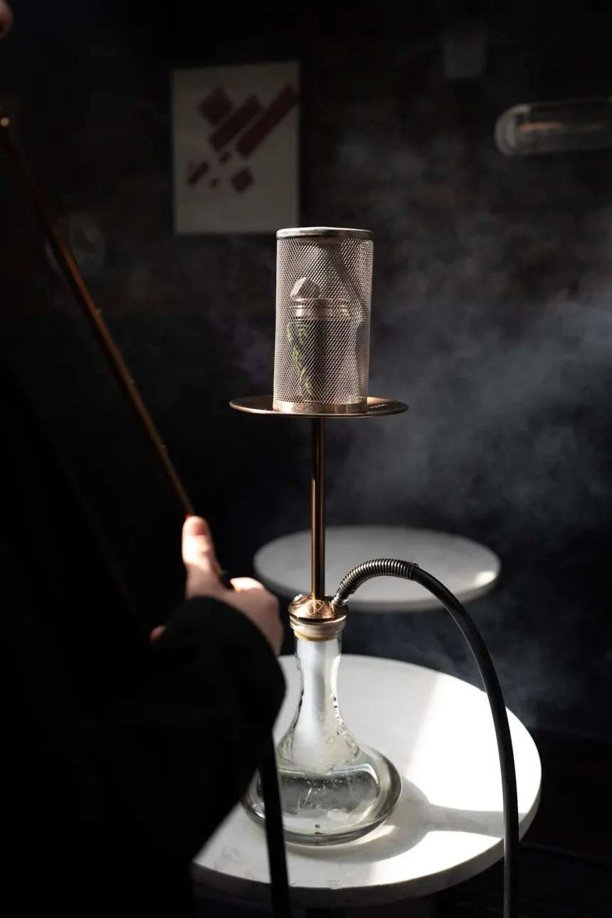 Rose-gold hookah stem on a marble table at Laika Shisha Lounge in Soho